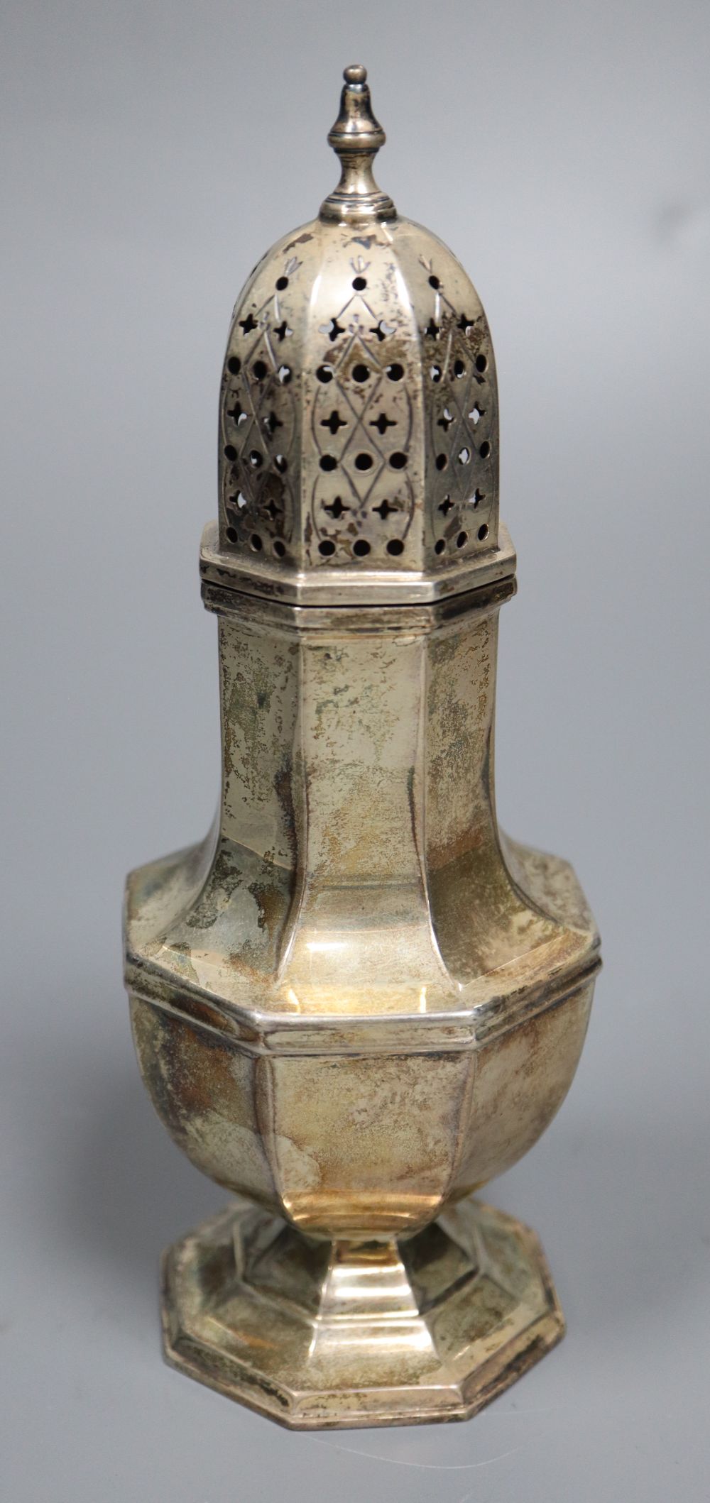 A 1930s silver octagonal sugar caster, 18cm, 5.5oz.